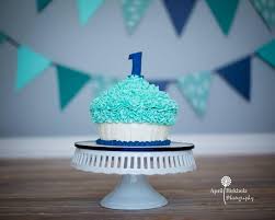 To celebrate we created this two tier ball themed cake with a colorful palette of blue, yellow, orange and red. Blue Boy 1st Birthday Giant Cupcake Smash Cake By Nicky B S Cakes Photo By April Birkholz Photograp Smash Cake Boy 1st Birthday Cake Smash Birthday Cake Smash