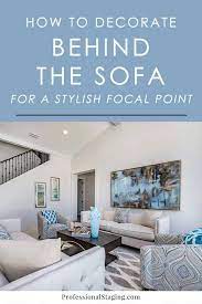 Macrame hangings can also add a pop of color, if you choose one with a colorful ombré fringe. How To Decorate The Wall Behind The Sofa Mhm Professional Staging