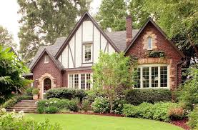 The facades of tudor style homes are often dominated by one or more prominent steeply pitched cross. Tudor Style House Tudor Home Architecture Tudor Design Houses