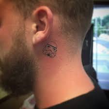Devotees of the empire can revel in their sith associations with this distinctly noticeable caricature. Stormtrooper Tattoo Behind The Left Ear