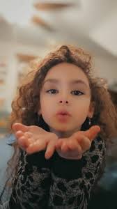 I don't know if this is possible but I was hoping someone could help me by  making it look like my daughter is blowing glitter out of her hands. Thank  you ❤️