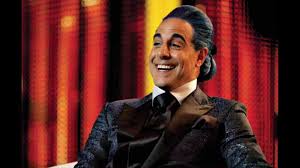 The american actor makes his british tv debut in sky atlantic's arctic thriller. Watch Every Time Caesar Flickerman Laughs In The Hunger Games Movies Mtv