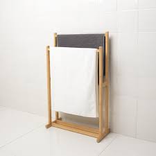 A watched pot never boils, and a wet towel on the floor never dries. Ragrund Towel Stand With 2 Rails Bamboo Ikea