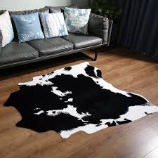 Next, use a gentle spot cleaning solution to cut the smell of the stain and help the fibers of the rug release the urine. Black And White Cow 4 6 X 5 2 Faux Cowhide Rugs 4 6 X 5 2 Black And White Cow Skin Hide Area Rug For Home Home Area Rugs