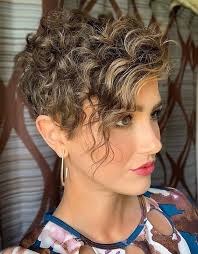 A curly pixie cut is a short haircut for women with naturally curly hair that's cropped into layers, creating a tousled effect. Most Beautiful Short Curly Hair Ideas For 2019 Stylesmod Pixie Haircut For Thick Hair Short Curly Haircuts Short Hair Styles Pixie