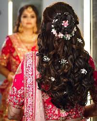 Curls With A Center Low Bun Indian Bride Hairstyle Bridal Hair Buns Engagement Hairstyles