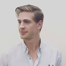 The fade curves around the head, dipping towards the nape. The Classic Ivy League Haircuts Hairstyle On Point