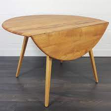 An unfinished furniture expo online exclusive. Ercol Round Drop Leaf Dining Table 1960s 135776