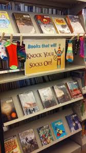 Books That Will Knock Your Socks Off Book Display Joliet Public Library Black Road Branch Library Book Displays Library Signage Library Displays