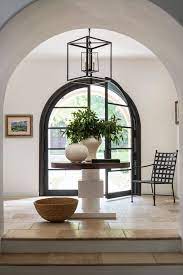 Large stylish foyer with tiles flooring and white walls. How To Style A Round Entry Table Step By Step Guide 10 Photos