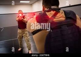 U.S. AIR FORCE ACADEMY, Colo. -- Maj Daniel Speir uses a Shot Indicating  Resetting Trigger (SIRT) Training Pistol during the completion of his Air  Force Combatives Program (AFCP) Master Instructor Certification at