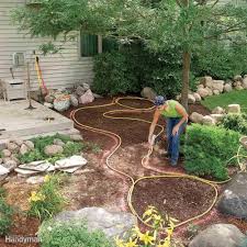 When You Re Designing Something Curvy A Pond Retaining Wall Or Flower Bed Lay It Out W Backyard Garden Landscape Backyard Garden Layout Small Backyard Gardens
