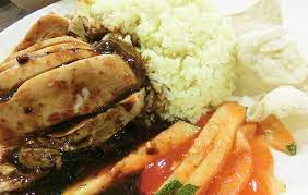 Ayam penyet (javanese for smashed fried chicken) is indonesian — more precisely east javanese cuisine — fried chicken dish consisting of fried chicken that is smashed with the pestle against mortar to make it softer, served with sambal, slices of cucumbers, fried tofu and tempeh. Nasi Ayam Malaysia Black Pepper Malacca Malaysia Asian Food