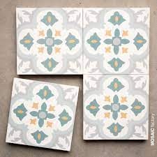 Whether you're looking for kitchen backsplash tile, bathroom tiles, shower floor tile, or something totally different, we can help you find the perfect tiles to meet all of your needs and transform your home. White Grey And Teal Patterned Floor And Wall Tile From Mosaic Factory S Cement Tile Collection Classic Mosaicfa Tile Patterns Classic Tile Scandinavian Tile