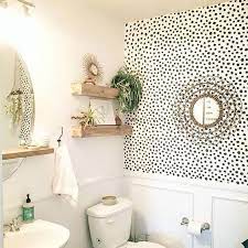 The wood flooring in a raw finish, some indoor plants, and round decorative jute rug complement the wallpaper to bring the boho style to the room. 35 Small Bathroom Decor Ideas That Will Inspire In 5 Design Styles