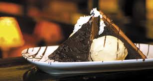 Dark fudge brownie with vanilla ice cream, fresh strawberries and chocolate sauce. Death By Chocolate Award Longhorn Steakhouse Feast Awards 2014