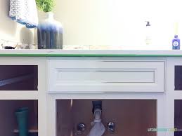For deeper cleaning, spray oil soap wood cleaner onto the cabinets and gently rub it in with a towel. How To Paint Thermofoil Cabinets Life On Virginia Street