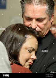 Laura Baanstra, sister of Jay Cook, with her husband Gary Baanstra hug  during the press conference after William Talbott II was found guilty,  Friday, June 28, 2019, at the Snohomish County Courthouse