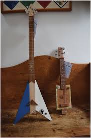 Have you already made yourself a cigar box guitar or a series of other cigar box instruments, but now you're like to start making diy accessories for your actual guitar as well? Nick S Flying V And Standard Four String Cigar Box Guitars Download Scientific Diagram