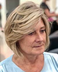 Try an inverted bob with a center part. 18 Volume Boosting Haircuts For Older Women With Thin Hair