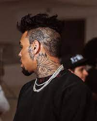 Here is a priceless guide on how to choose the perfect tattoo! Chrisbrownofficial On Set Of The Heat Music Video Chris Brown Tattoo Breezy Chris Brown Chris Brown