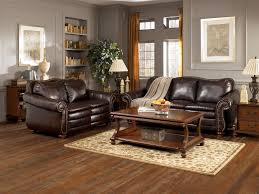 Present contemporary colors and furniture silhouettes alongside more traditional pieces to fashion a memorable living room. Living Room Magnificent Living Room Decorations Ideas Recommending Grey Walls Paints Sche Brown Living Room Decor Brown Furniture Living Room Brown Living Room