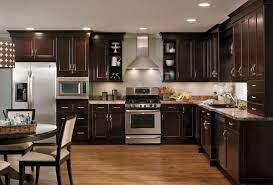 Old solid cherry and are stained a dark cherry color. Dark Stained Kitchen Cabinets Google Search Dark Wood Kitchen Cabinets Kitchen Cabinet Design Cherry Cabinets Kitchen