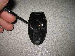 Turn over the key fob and locate the black plastic release switch. Nissan Murano Intelligent Key Fob Battery Replacement Guide 009