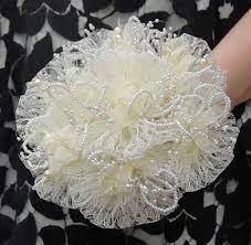 Brides hand tied wedding bouquet ivory roses with gyp. A Stunning Vintage Inspired Bouquet With Lots Of Loops Of Lace Effect Loops Of Pearls And Wedding Bridal Bouquets Bridal Bouquet Artificial Wedding Bouquets