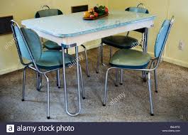 a modern dinner set, table and chairs