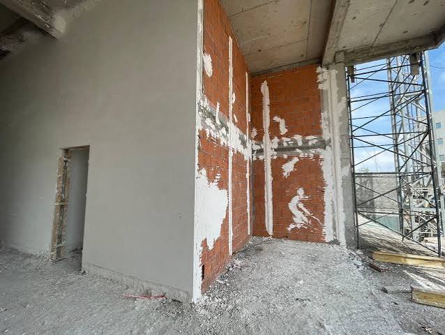 Façade bâtiment commercial enduit monocouche — Fès