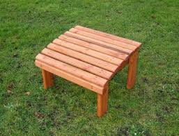 The chair and bench set would look good in any garden. Wooden Garden Foot Stool Tony Ward Furniture