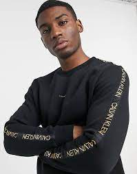 Since 1968, calvin klein designer handbags have offered perfected minimalistic designs and innovative patterns. Calvin Klein Gold Capsule Central And Tape Logo Sweatshirt In Black Asos