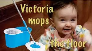 Victoria mops the floor