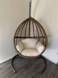 belham living tanna tear drop resin wicker hanging egg chair with cushion and stand hayneedle hanging egg chair diy chair cushions bamboo chair makeover
