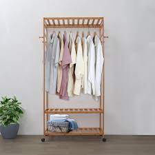 Crafted from metal with engineered wood shelves, this piece delivers a mixed material look, and a streamlined silhouette for a modern feel. Wooden Clothes Hanger With Shelves Lodyhome