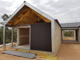 Matt Monument Colorbond Wall Cladding Being Installed On Our Wigleyflat House Riverland Mountford House Exterior Cladding Exterior Cladding House Exterior