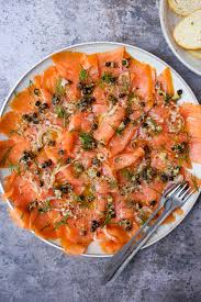Remove the potatoes and bacon from the oven and transfer to a serving plate/bowl, draining off any excess grease. Smoked Salmon Carpaccio With Fried Capers And Herbs