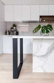 A breakfast bar is either a full kitchen island or a countertop overhang with a height that has enough room for the legs and a size that can accommodate ample room for meals. Kitchen Island Square Flat Metal Leg Support Modern Kitchen Melbourne By Hx Design Houzz Au
