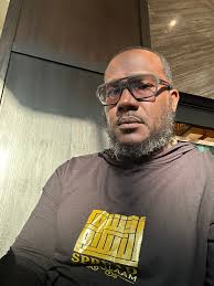 New member of the group, owner of a local business