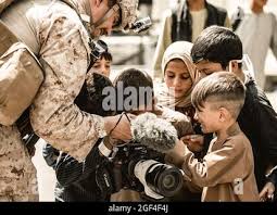 U.S. Marine Corps Gunnery Sgt. Derek Strasser with Marine Corps Combat  Service Support Schools narrates during the Instructor of the Year Award  Ceremony held aboard Camp Johnson, N.C., March 31, 2016. One