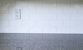 Amazing gallery of interior design and decorating ideas of calacatta quartz kitchen backsplash in kitchens, media rooms by elite interior designers. White Kitchen Backsplash With A White Outlet On The Left Side Stock Photo Picture And Royalty Free Image Image 21131025