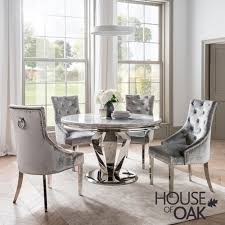 Novara chrome round glass dining table and 4 velvet faux leather dining chairs. Arturo Grey 130cm Round Dining Table House Of Oak