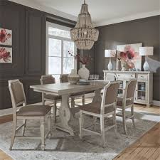 From modern oak to pearly white finishes we carry a wide selection of tables and chairs to suit nearly any style. Low Country Gathering Counter Height Table 7 Piece Dining Set In Sea Oat White Finish By Liberty Furniture 585 Dr 7gts