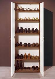 Crafted of wood in a rustic brown finish, the tall cabinet features two drawers, two doors and three storage shelves. Andre White 2 Door Tall Storage Cabinet With Doors Furniturefactor