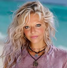 The bus and crosses at Gauley Bridge , WV. The confluence where the Gauley  and New rivers merge to become the Kanawha river is marked by two large  clumps of rocks. On