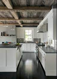 This hardiplank shiplap kitchen features white paneling around the room. Blogger Black Quartz Kitchen Countertops Outdoor Kitchen Design Outdoor Kitchen Countertops