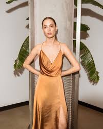 Draped To Perfection The Ariela Is A Petti Length Cocktail Dress Featuring A Draped Neckline An Open Back With Cross Dresses Dress Accessories Cocktail Dress