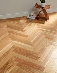 This attractive tile features chips of natural marble tile in a herringbone pattern on a 12 in. Branscombe Natural Coastal Herringbone Oak Engineered Wood Flooring Direct Wood Flooring