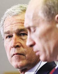 Bush, Putin meet for last time still divided